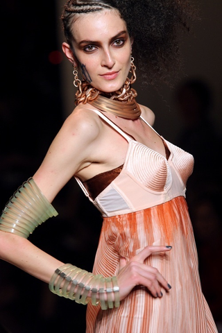 Illustration for article titled Jean-Paul Gaultier: Brights, Bras, Bellies, And Braids